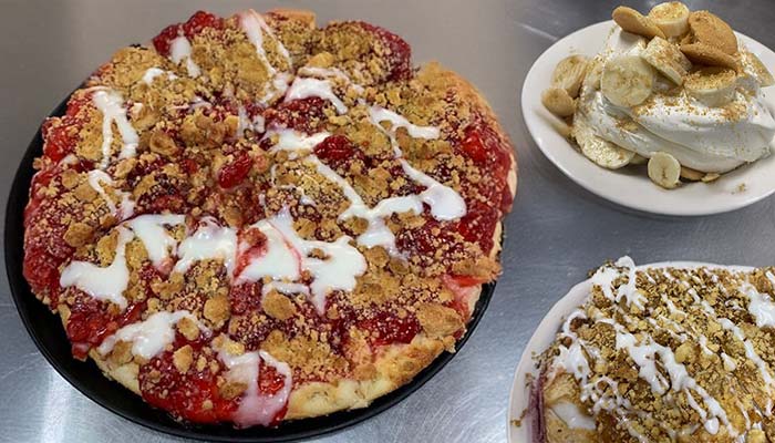 A strawberry dessert pizza topped with white icing and crumbled cookie at Gatesville Bar, served alongside banana pudding with whipped cream and vanilla wafers, plus a plate of dessert with whipped cream and nuts.